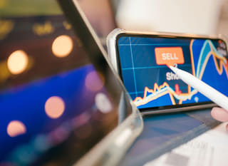 Trader examining Bitcoin, Ethereum and foreign exchange options across multiple markets
