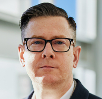Portrait of Alexander Hughes, chief executive officer of a cryptocurrency trading firm